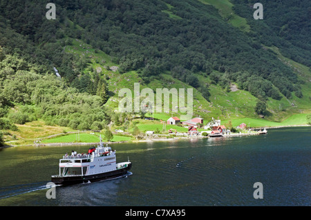 The narrows at Bakke on the Nœröyfjorden in Western Norway with Fjord1 car and passenger ferry Fjœrlandsfjord heading north Stock Photo