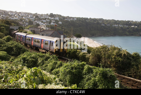 The GWR train from St Ives underway around Carbis Bay, Cornwall, England. Stock Photo