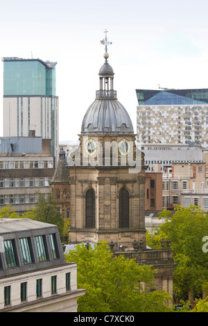 St. Philips cathedral in Birmingham. England, along with The Cube building in the rear. Stock Photo