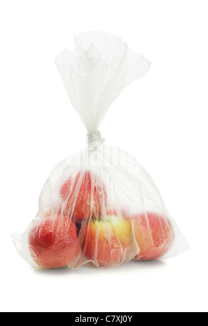 Red apples in translucent plastic bag on white background Stock Photo