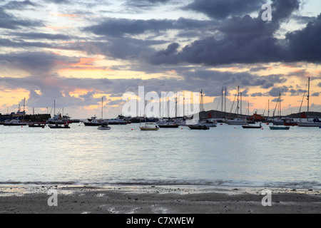 Hugh Town harbour from Porth Mellon Beach, St Marys, Isles of Scilly, Cornwall, stormy sunset Stock Photo