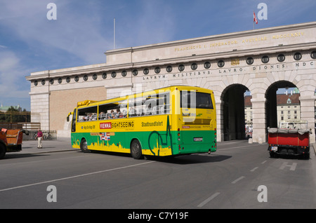 sightseeing bus outside Hofburg Palace in Vienna Stock Photo
