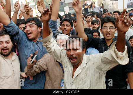 Protesters shout slogans against electricity load-shedding during protest demonstration of traders Stock Photo