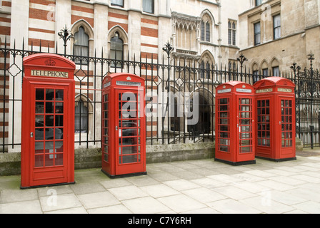 Red British retro telephone boxes Carey street London UK Large and small Sir Giles Gilbert Scott design. Stock Photo
