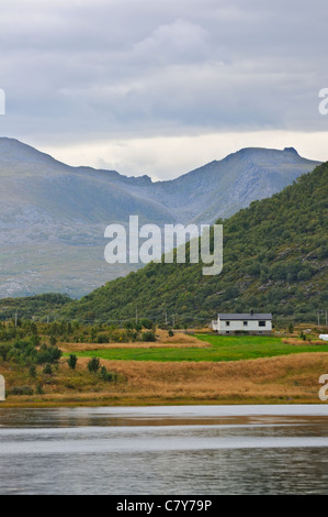 Little House on the shores of a mountain lake in Norway Stock Photo