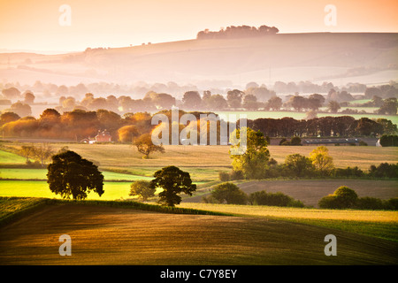 An early autumn sunrise view from Martinsell Hill over the Vale of Pewsey in Wiltshire, England, UK Stock Photo