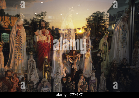 Portugal, Fatima, religious statues in window shop Stock Photo