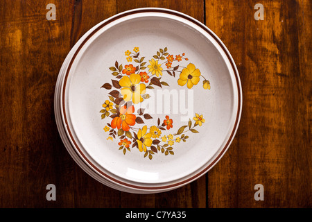 Top view of autumn plates stack on a wooden surface Stock Photo