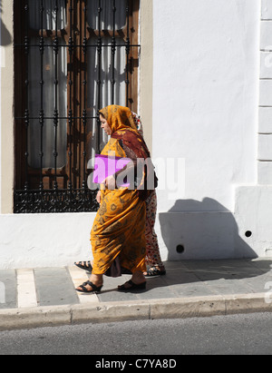 Two women dressed in traditional Islamic robes, Ronda, Andalusia, Spain Stock Photo