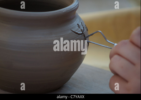 The potter creating an artistic jug from the clay Stock Photo