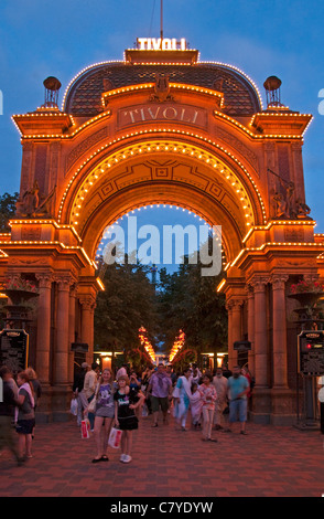 Illuminated entrance at night to Tivoli Gardens amusement park in Copenhagen Stock Photo