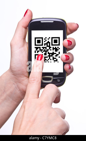 hand holding smartphone with qr code Stock Photo