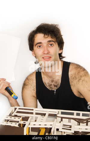 Architect men working on a model of a new construction. Stock Photo