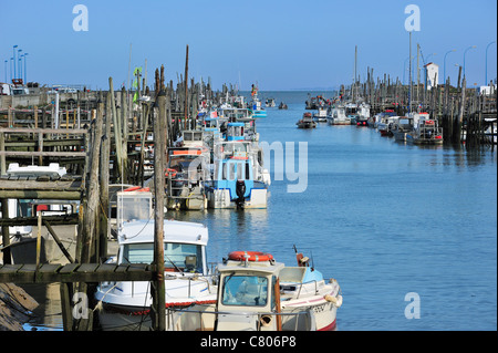 Fishing boats and oyster farming boats in the harbour Port du Bec near Beauvoir-sur-mer, La Vendée, Pays de la Loire, France Stock Photo
