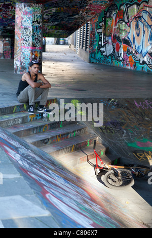 Grafitti-land on the South Bank, London - resting cyclist 2 Stock Photo