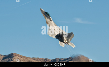 A U.S. Air Force F-22 Raptor takes off from Nellis Air Force Base, Nevada. Stock Photo