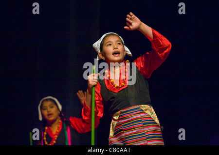 TIBETAN DANCERS at the TIBETAN MONGOLIAN CULTURAL CENTER during a teaching by the 14th DALAI LAMA - BLOOMINGTON, INDIANA Stock Photo