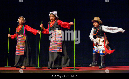 TIBETAN DANCERS at the TIBETAN MONGOLIAN CULTURAL CENTER during a teaching by the 14th DALAI LAMA - BLOOMINGTON, INDIANA Stock Photo