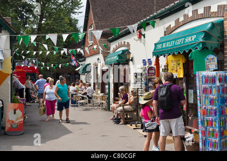 Shops and pavement cafe in the village of Burley in the New Forest, Hampshire, England, UK Stock Photo