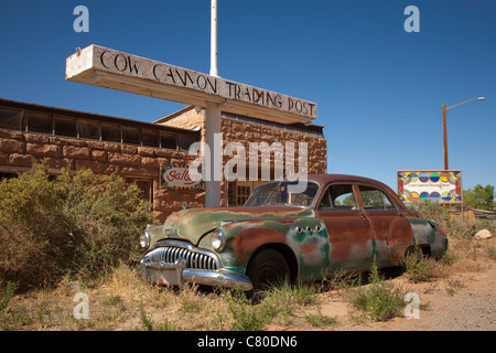 Old rusted Buick Eight car outside Cow Canyon Trading Post beside Federal Highway 191 at Bluff in Utah USA on a sunny summer day Stock Photo