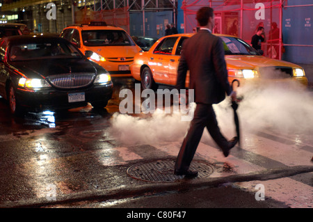 Usa, New York City, Times Square, Walking Man in Crosswalk. Stock Photo