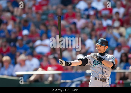 Seattle Mariners' Ichiro Suzuki, of Japan, right, is greeted at home by  teammates Jeremy Reed, left, and Yuniesky Betancourt, after hitting a  three-run homer off Los Angeles Angels pitcher Kevin Gregg in