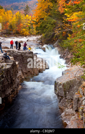 Tourists at Rocky Gorge Falls along the Kancamagus Highway near Conway, New Hampshire, USA Stock Photo