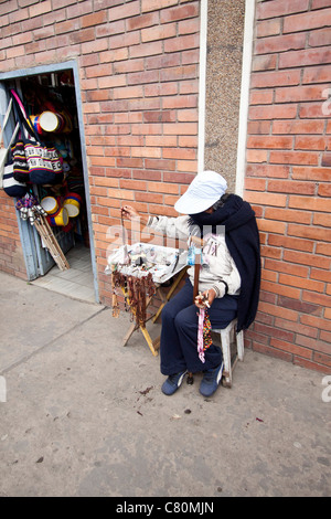 peddler in the street showing her merchandise. Chiquinquirá, Boyacá, Colombia, Andes region, South Americaverti Stock Photo