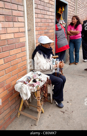 peddler in the street showing her merchandise. Chiquinquirá, Boyacá, Colombia, Andes region, South Americaverti Stock Photo