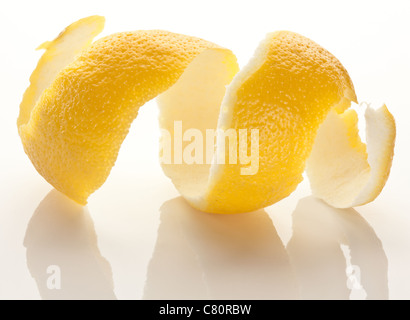 Twist of citrus peel on a white background. Stock Photo