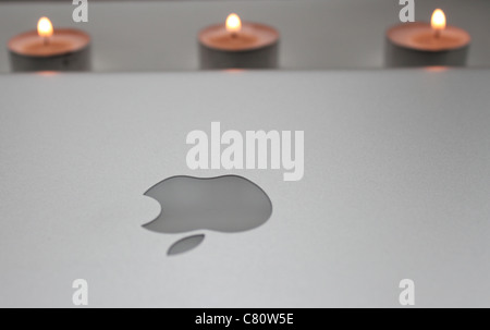 Apple computer with candles Stock Photo