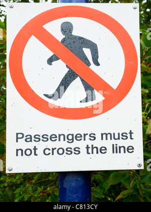 Passengers Must Not Cross the Line Notice on a station platform end on a rural branch line Middlesbrough to Whitby Railway Stock Photo