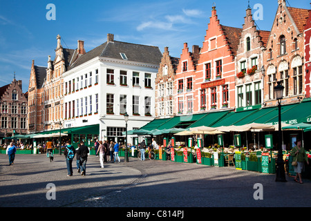 Bars, cafes, restaurants, and tourists in the Grote Markt or Market Square in Bruges, (Brugge), Belgium Stock Photo