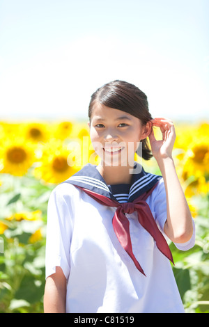 Young Schoolgirl in Sunflower Field