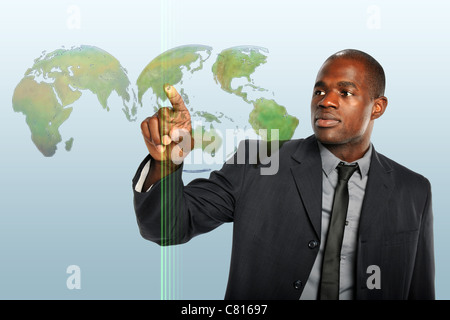 African American businessman touching world map hologram Stock Photo