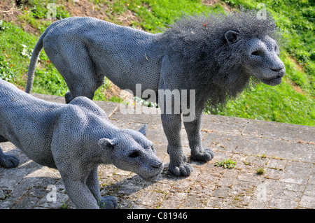 Wire mesh Lions made by Artist Kendra Haste Modern animal sculpture near ruins of the Lion Tower Stock Photo