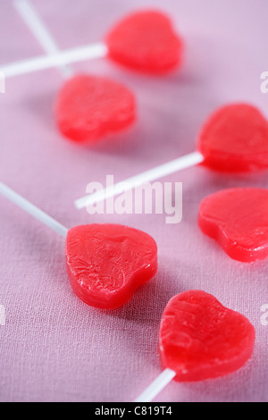 Group of red heart-shape lollipops Stock Photo