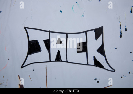 Scrawl and Graffiti on a wall in St Helens, Merseyside, UK Stock Photo