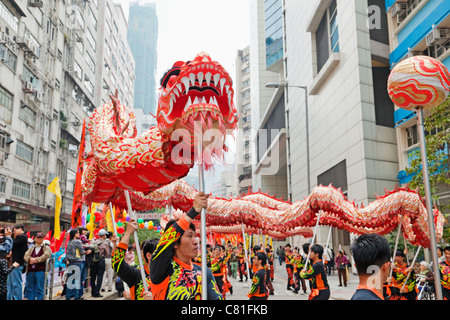 China, Hong Kong, Tai Kok Tsui Temple Fair, Dragon Dance Stock Photo