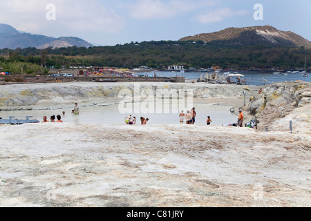 People in mud pond for beauty treatment, island of Vulcano, active volcano in Eolie, Aeolian Islands, Sicily, Sicilia, Italy Stock Photo