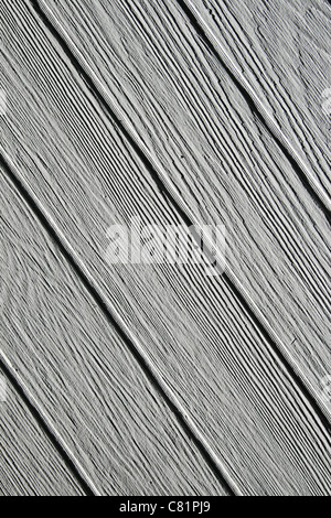 background of diagonal gray painted wooden boards with side lighting Stock Photo