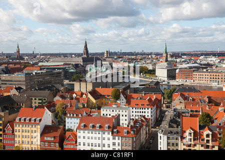 Aerial view over the roofs of inner capital city Copenhagen and the governmental and financial district. Parliament building Christiansborg Castle. Stock Photo