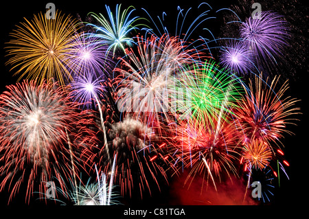 Fireworks of various colors busting against a black sky Stock Photo