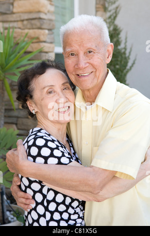 Chinese couple hugging Stock Photo - Alamy