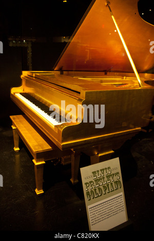 Gold grand piano belonging to Elvis Presley on display at the Country Music Hall of Fame, Nashville Tennessee USA Stock Photo