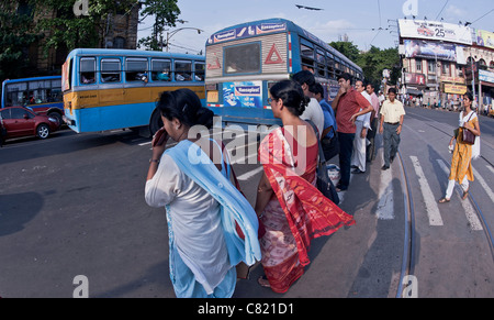 Female passers -by on busy crossing at J.L.Nehru Rd.crossing ,in Central district ,Kolkata-India. Stock Photo