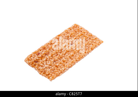 A Sesame Snaps sesame seed biscuit on a white background Stock Photo