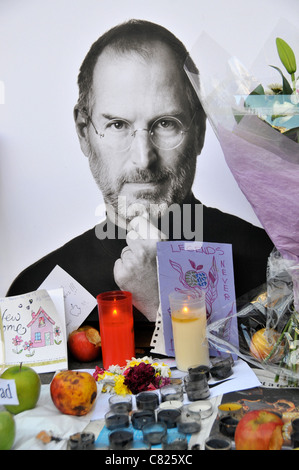 Steve Jobs death memorial shrine Apple Store flowers apples and cards outside the Regent Street store London 7th October 2011 Stock Photo