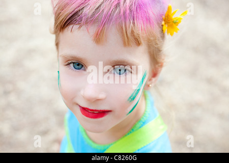 blue eyes children girl painted face makeup in outdoor party
