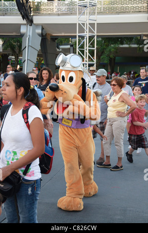 magic kingdom street party with pluto and guests Stock Photo